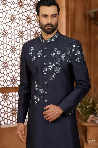 Blue classic indo-western sherwani set with handwork on the neck & buttons, featuring resham thread, stone & beads work.
