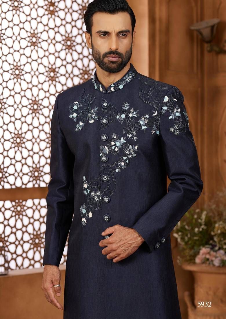 Blue classic indo-western sherwani set with handwork on the neck & buttons, featuring resham thread, stone & beads work.