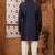 Blue classic indo-western sherwani set with handwork on the neck & buttons, featuring resham thread, stone & beads work.