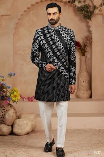 Black classic velvet indo-western sherwani set with full computer embroidery, thread and star work, and fancy buttons.