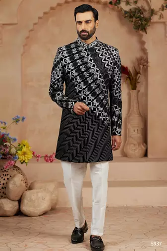 Black classic velvet indo-western sherwani set with full computer embroidery, thread and star work, and fancy buttons.
