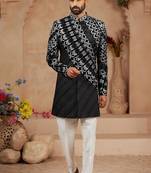Black classic velvet indo-western sherwani set with full computer embroidery, thread and star work, and fancy buttons.