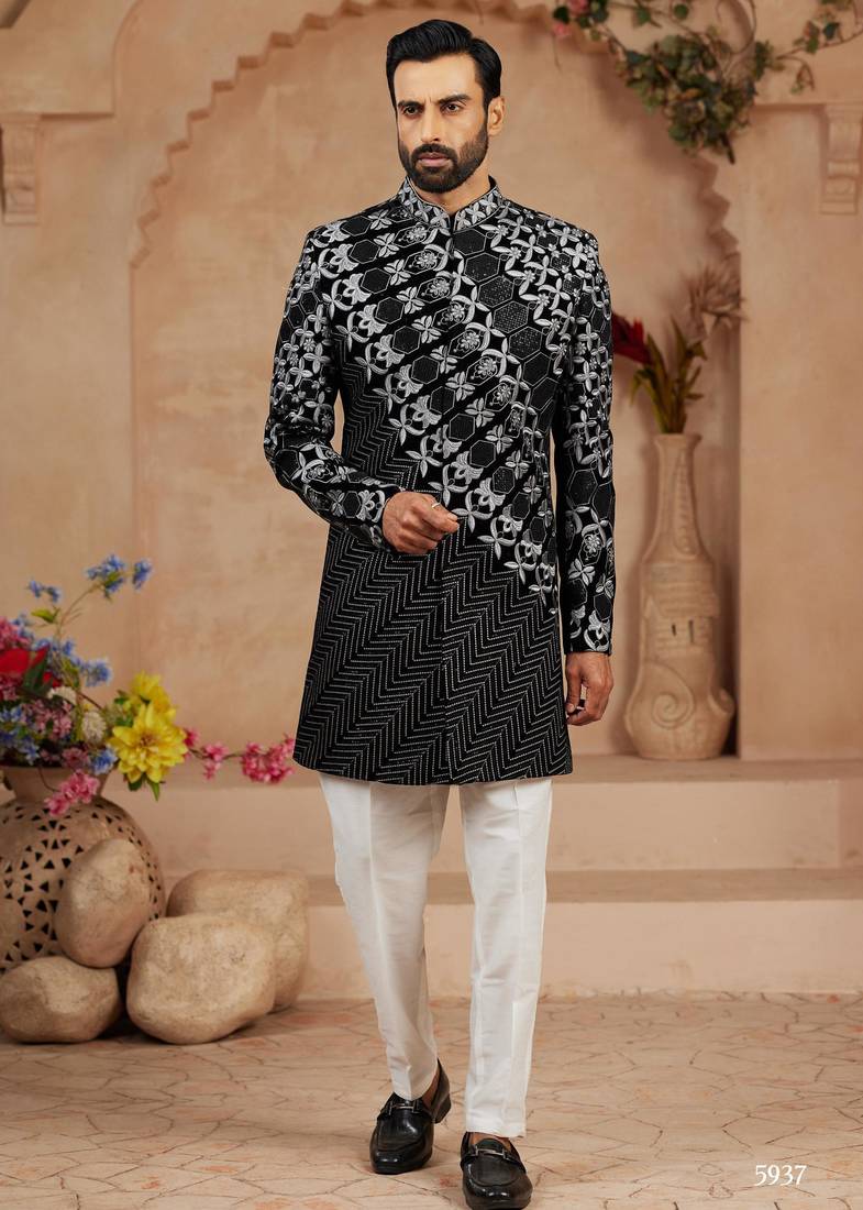 Black classic velvet indo-western sherwani set with full computer embroidery, thread and star work, and fancy buttons.