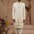 Cream heavy sherwani three-piece set with full hand embroidery, stone work, and resham thread detailing.
