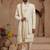 Cream heavy sherwani three-piece set with full hand embroidery, stone work, and resham thread detailing.