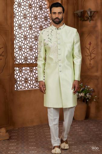 Pista green classic indo-western sherwani set with handwork on neck & buttons,resham thread, stone & beads work.