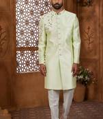 Pista green classic indo-western sherwani set with handwork on neck & buttons,resham thread, stone & beads work.