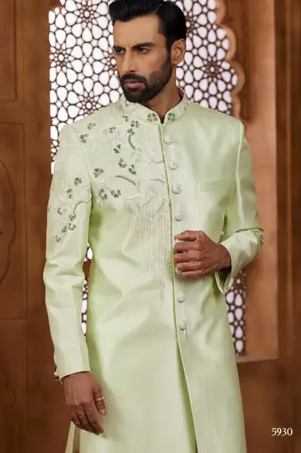 Pista green classic indo-western sherwani set with handwork on neck & buttons,resham thread, stone & beads work.