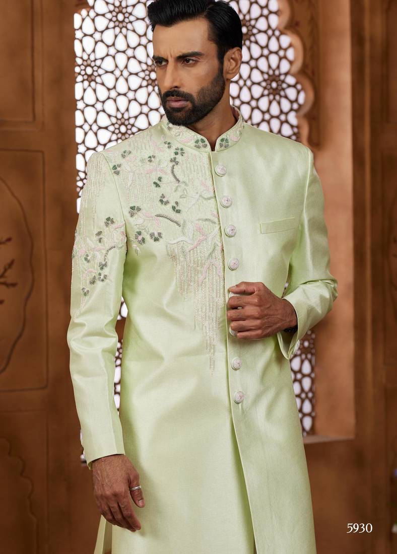 Pista green classic indo-western sherwani set with handwork on neck & buttons,resham thread, stone & beads work.