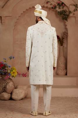 Cream heavy sherwani three-piece set with full hand embroidery, stone work, and resham thread detailing. 4