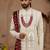 Cream heavy sherwani set with full hand embroidery, stone work, and resham thread detailing.