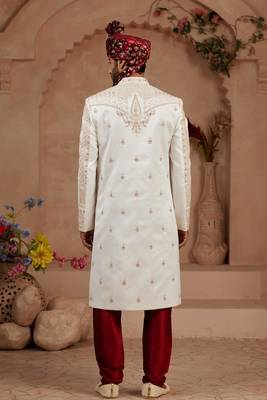 Cream heavy sherwani set with full hand embroidery, stone work, and resham thread detailing. 4
