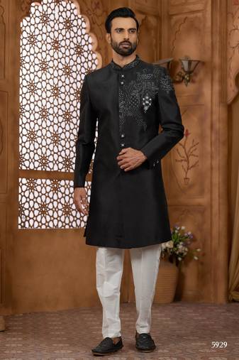 Black classic indo-western sherwani set with handwork on neck & buttons,resham thread, stone & beads work.