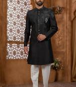 Black classic indo-western sherwani set with handwork on neck & buttons,resham thread, stone & beads work.