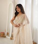 Cream chiffon zari embroidered saree with unstitched blouse piece.