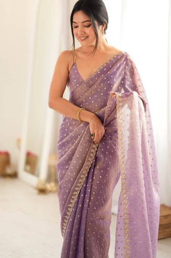 Lilac chiffon zari embroidered saree with unstitched blouse piece.
