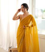 Mustard chiffon zari embroidered saree with unstitched blouse piece.