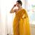 Mustard chiffon zari embroidered saree with unstitched blouse piece.