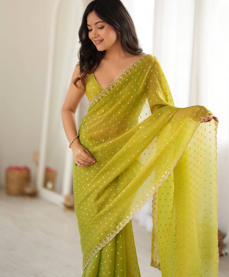 Neon chiffon zari embroidered saree with unstitched blouse piece.