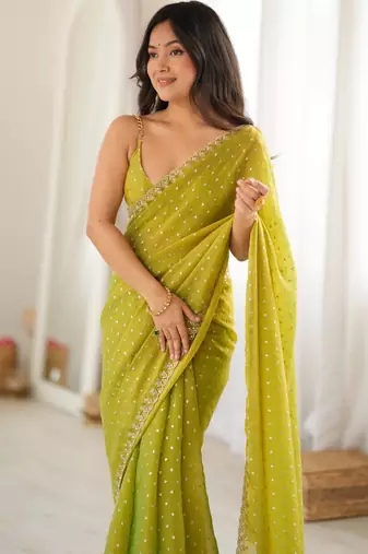 Neon chiffon zari embroidered saree with unstitched blouse piece.