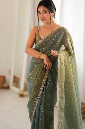 Olive chiffon zari embroidered saree with unstitched blouse piece.