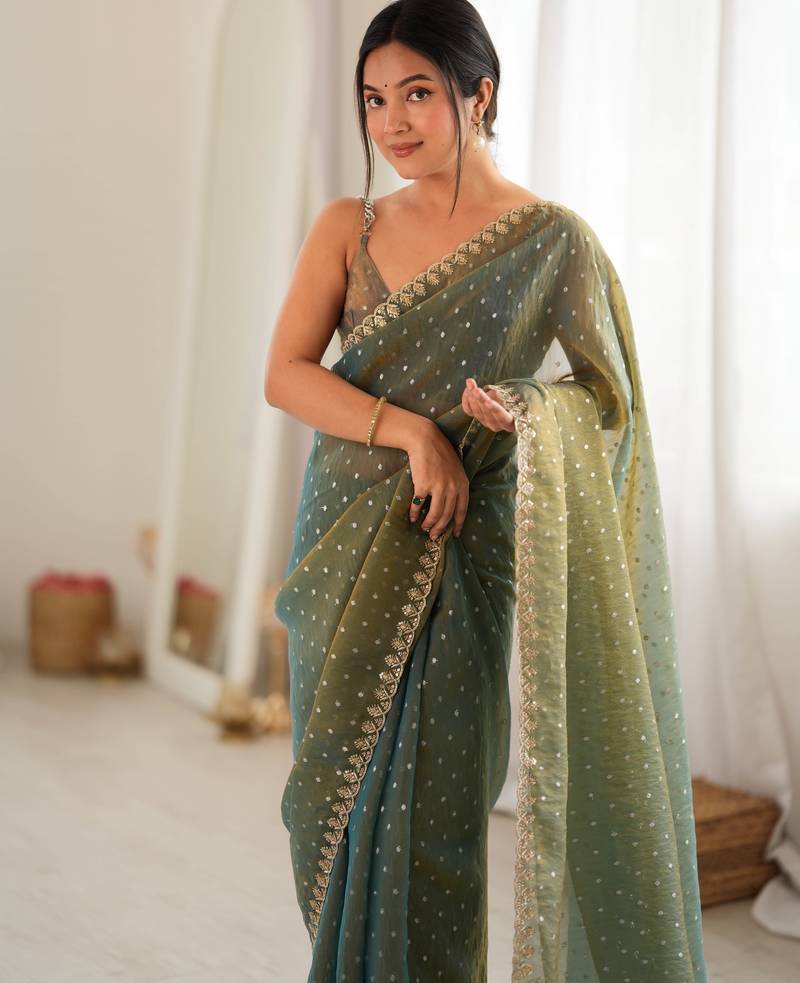 Olive chiffon zari embroidered saree with unstitched blouse piece.
