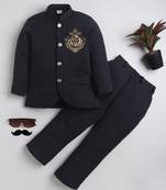 Boys black lycra floral embroidered bandhgala blazer & trouser set with metal crest