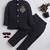 Boys black lycra floral embroidered bandhgala blazer & trouser set with metal crest