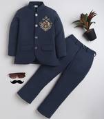 Boys navy blue lycra floral embroidered bandhgala blazer & trouser set with metal crest
