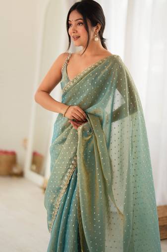 Rama chiffon zari embroidered saree with unstitched blouse piece.