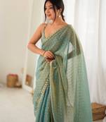 Rama chiffon zari embroidered saree with unstitched blouse piece.