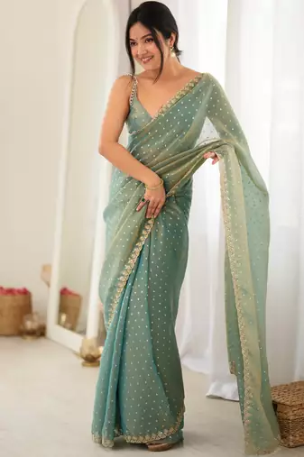 Rama chiffon zari embroidered saree with unstitched blouse piece.