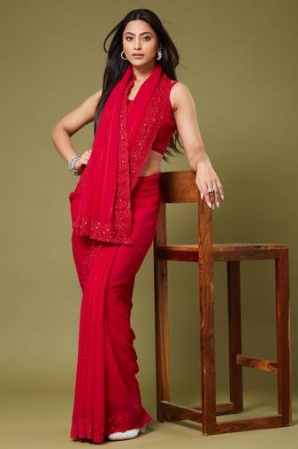 Red georgette sequins saree with unstitched blouse piece.