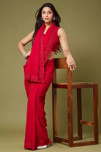 Red georgette sequins saree with unstitched blouse piece.