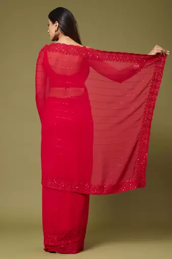 Red georgette sequins saree with unstitched blouse piece.
