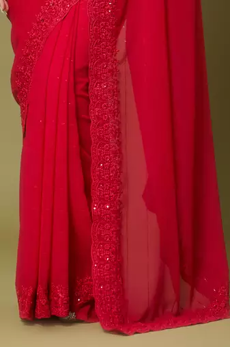 Red georgette sequins saree with unstitched blouse piece.