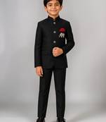 Boys black lycra solid indo-western blazer & trouser set with elephant brooch