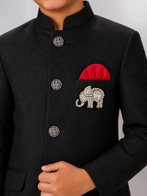 Boys black lycra solid indo-western blazer & trouser set with elephant brooch 3