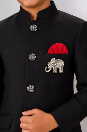 Boys black lycra solid indo-western blazer & trouser set with elephant brooch