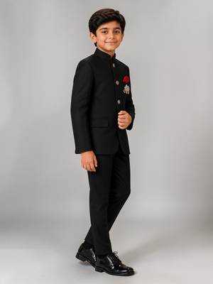 Boys black lycra solid indo-western blazer & trouser set with elephant brooch 5