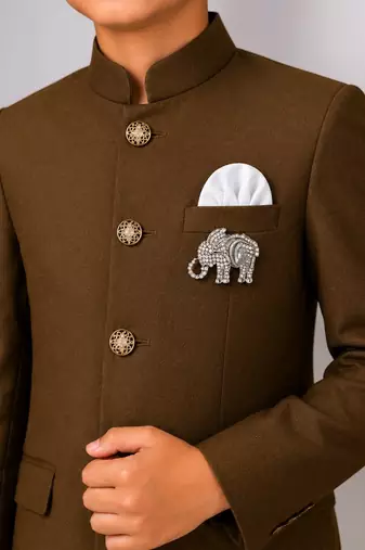 Boys brown lycra solid indo-western blazer & trouser set with elephant brooch