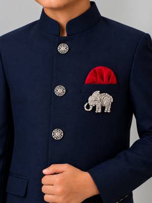Boys navy blue lycra solid indo-western blazer & trouser set with elephant brooch 3