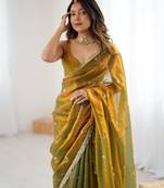 Gold tissue satin sequins saree with unstitched blouse piece.