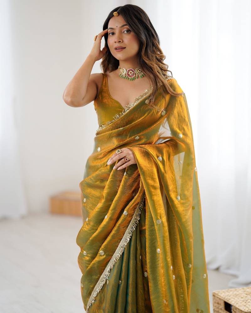 Gold tissue satin sequins saree with unstitched blouse piece.