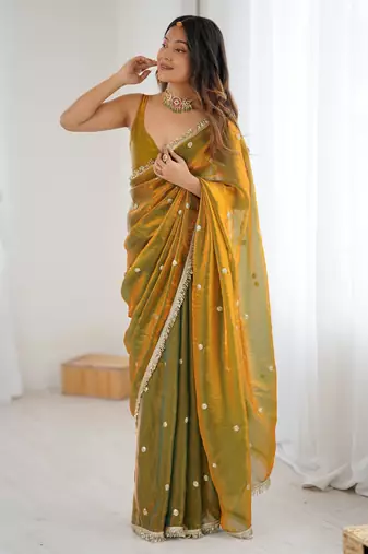 Gold tissue satin sequins saree with unstitched blouse piece.