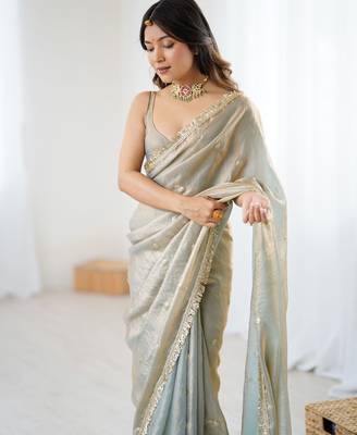 Grey tissue satin sequins saree with unstitched blouse piece. 1
