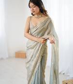 Grey tissue satin sequins saree with unstitched blouse piece.