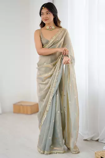 Grey tissue satin sequins saree with unstitched blouse piece.