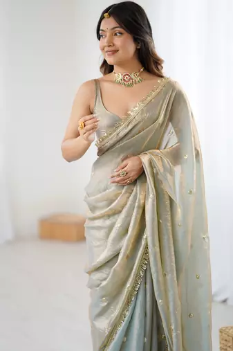 Grey tissue satin sequins saree with unstitched blouse piece.