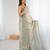 Grey tissue satin sequins saree with unstitched blouse piece.